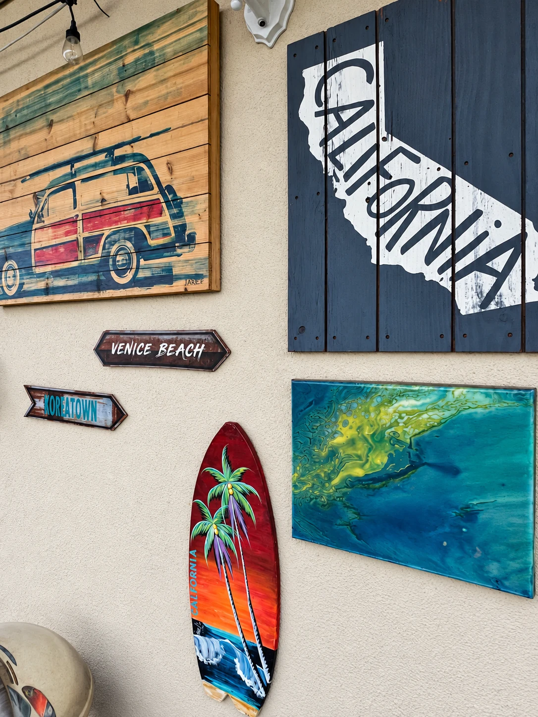 California-themed wall art and surfboard decor at the So Fly setting
