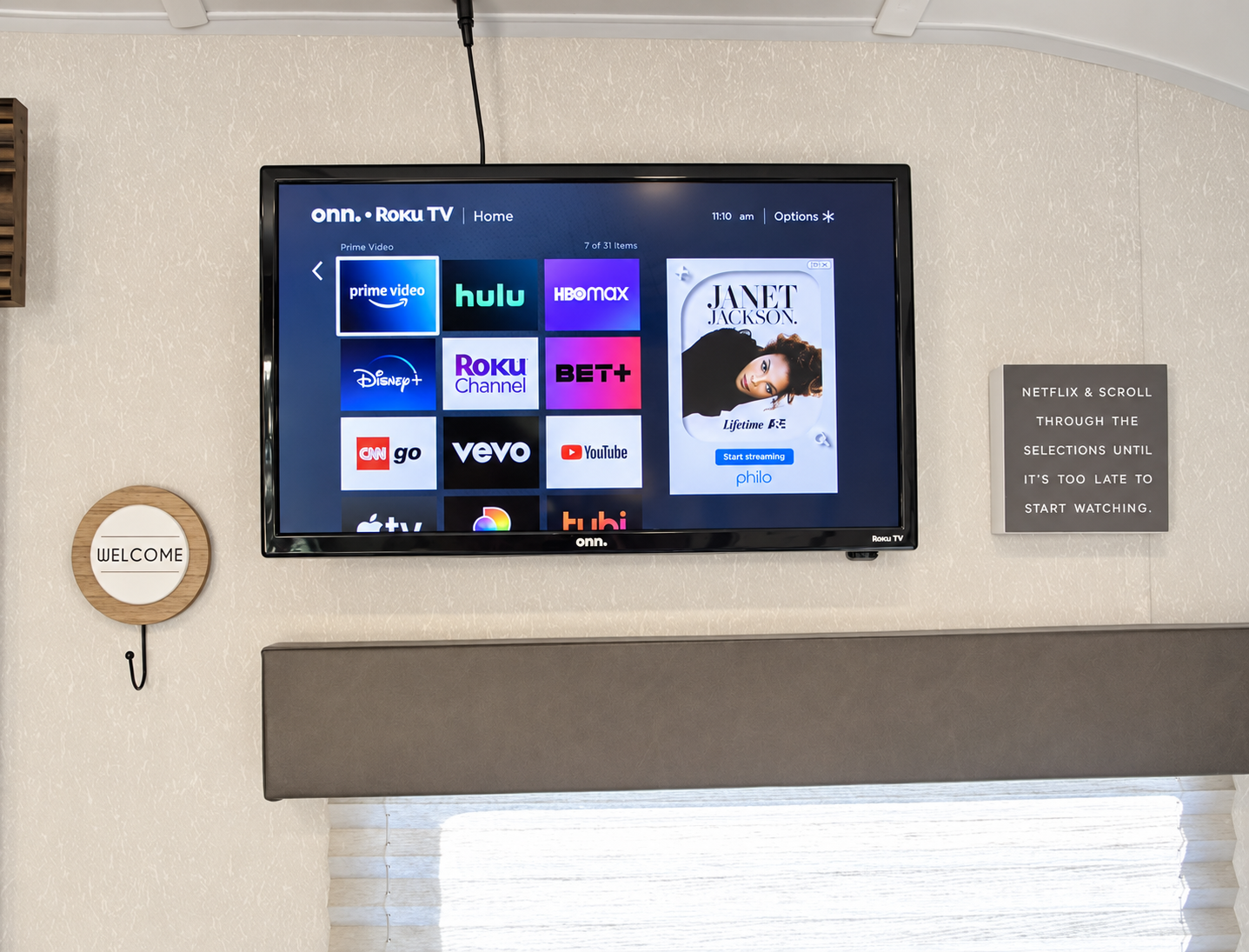 The camper lounge with its television and window shade